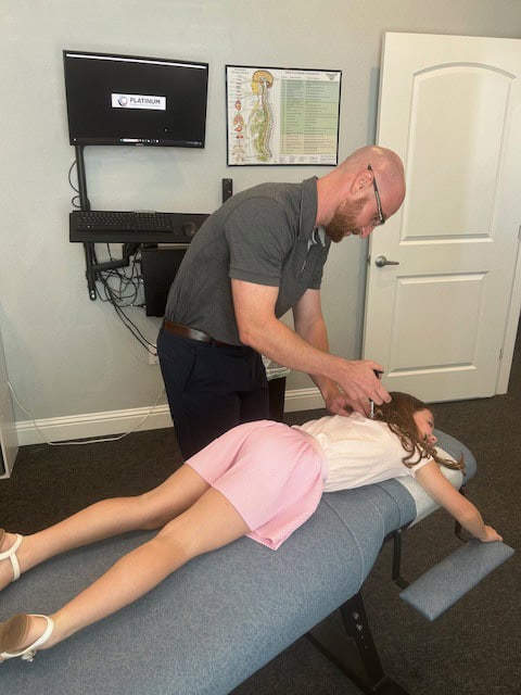 Who We Help 3 Chiropractic adjustment for pediatric patient at Antignolo Chiropractic.